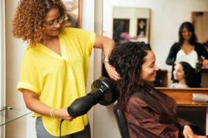 Hairdressers are providing support for Black women's mental health by being allies.